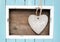 Light blue colored frame and stone heart with the word Love