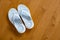 Light Blue Flipflops on Maple Hardwood Floor Indoors