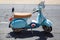 Light blue moped and helmet