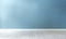 Light blue textured wall and wooden floor in empty room for displaying your product, light coming through window