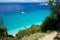 Light blue water on beach with sail ship on Gidaki on the Ithaca Ithaki or Ithaka island like paradise with blue sky in Greece