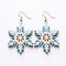 Light Blue Wooden Snowflake Earrings On White Background
