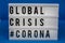 A light box with the inscription: GLOBAL CRISIS #CORONA
