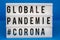 A light box with the inscription: GLOBALE PANDEMIE #CORONA with white background