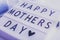 Light box with lettering Happy Mother`s Day, closeup macro