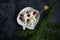 Light breakfast of rustic cottage cheese red cherries decorative white plates teaspoon