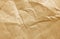 Light brown fibrous wrinkled kraft paper texture