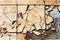 Light brown mosaic of broken kitchen tiles and gravel left on abandoned local construction site wallpaper texture background