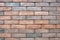 Light brown, red and grey bricks wall