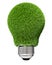 Light bulb covered with green grass.