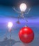 Light bulb figures with a red ball at night