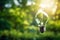 Light bulb on forest background, sustainability, renewable green energy and idea concept. generative ai