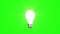 Light bulb on green background