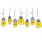 Light bulb hang from ceiling on wire. Electric lighting. Set of glass devices.