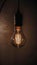 a light bulb hanging from a wire with a light bulb on it\\\'s side and a light bulb hanging from a wire