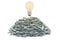 Light bulb on the heap of dollar packs, 3D rendering