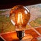 Light bulb with map, showing creative travel concepts and ideas