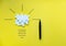 Light bulb over yellow background in vision and idea conceptual image. Conceptual image of creativity and idea. Jigsaw
