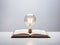 Light Bulb Resting on an Opened Book Positioned on a Desk.GenerativeAI.