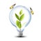 Light Bulb with soil and green plant sprout inside and butterfly