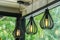 Light bulbs on vintage steel ceiling lamp cafe