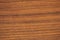 Light cherry, a flat surface of natural wood of brown color close-up.