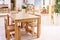 Light class in Montessori kindergarten. wooden children`s table with chairs in the foreground. nobody