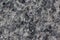Light coloured granite texture with black and gray spots. Used as a background.