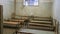 Light Coming in Through Prison Cell Bars Window. Empty Jail Cells. Prison Interior.