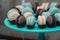 Light cream, tiffany blue and chocolate macaroons on tiffany blue stand. Food knolling concept