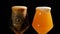 Light and dark beer is pouring into glasses.. IPA. Cold Light Beer in a glass with water drops. Craft Beer forming foam.