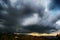 Light in the dark and dramatic storm clouds background. Storm clouds. Supercell Storm Cumulonimbus