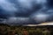 Light in the dark and dramatic storm clouds background. Storm clouds. Supercell Storm Cumulonimbus