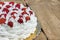 Light, delicate and tasty cream cake with fresh strawberries half cake