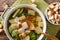 Light dietary soup with croutons close-up in a saucepan. horizon