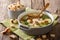 Light dietary soup with croutons close-up in a saucepan. horizon