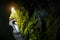 Light at the end of the tunnel on the path by the levada water canal on the Madeira Island.