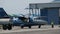 Light-Engine Propeller Aircraft with a Rotating Propeller Stands at the Hangar