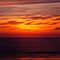 Light fiery sunset on the beautiful and bright ocean horizon