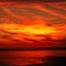 Light fiery sunset on the beautiful and bright ocean horizon