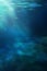 Light figure under water. Dark green water.  Depth of sea water, the bottom of the sea, the rays of the sun through the water, the