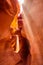 Light filters into an orange canyon portrait