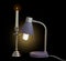 Light fixture with fluorescent lamp and burning candle in candle