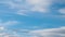 Light fluffy white clouds moving fast in time-lapse. Daylight, beautiful cloudy heaven background. Timelapse of