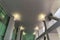 Light gray ceiling tiles and columns inside a building at Salt Lake City in Utah