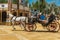 Light gray horse harnessed to the carriage. Side view. Horse Feria Feria de Caballo , Jerez de la Frontera, Andalusia, Spain, Ma