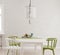 Light gray mock up wall, green white dining table and chairs with large window and radiator, Scandinavian style