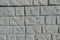 Light gray unpainted brick veneer wall texture