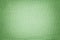 Light green background from a textile material. Fabric with natural texture. Backdrop