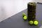 Light green Myofascial release massage balls, roll and other body roll recover on gray mat